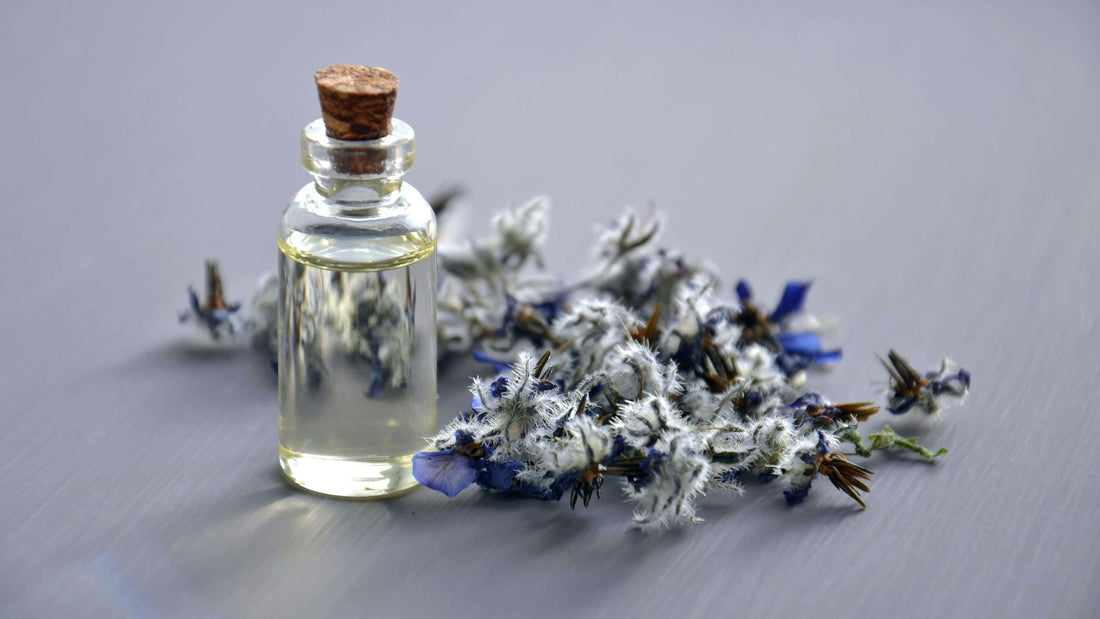 perfume essence and flower on a table